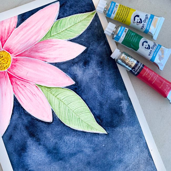 Colorful watercolor painting of a pink flower with art paint tubes on display.